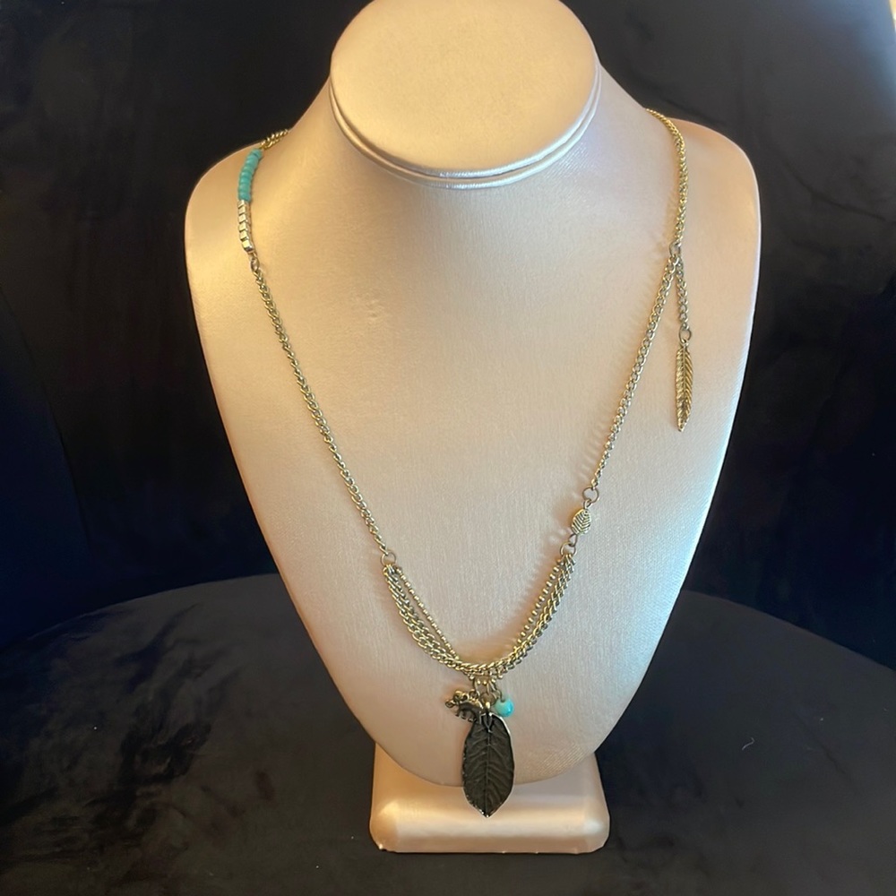 Brand new funky feather, elephant charm necklace; up to 19 inches long